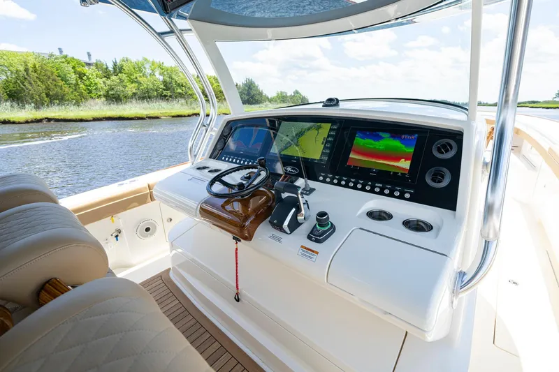 Slide: The Image of 2023 Valhalla Boatworks V-46 interior with luxurious seating and modern helm. - 11