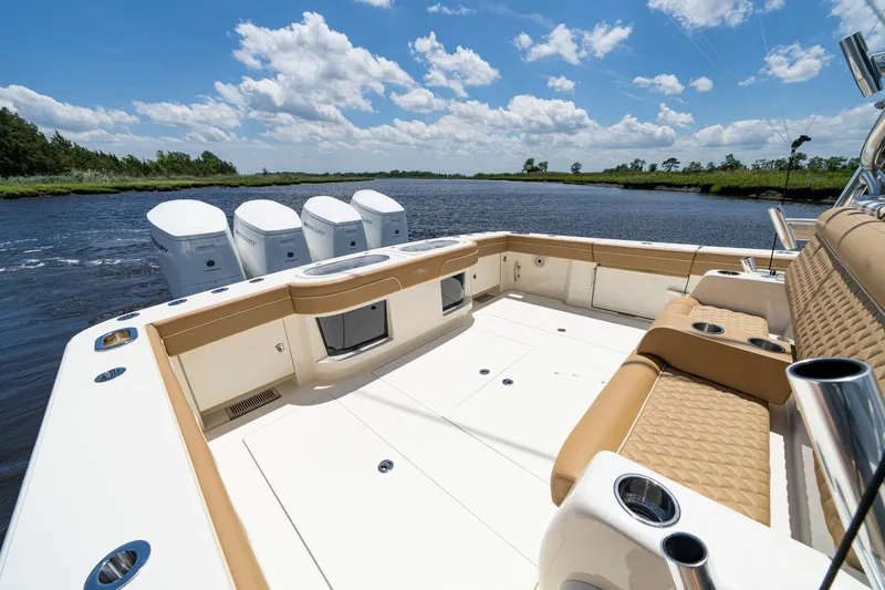 Slide: The Image of 2023 Valhalla Boatworks V-46 helm with modern controls and scenic ocean view. - 14