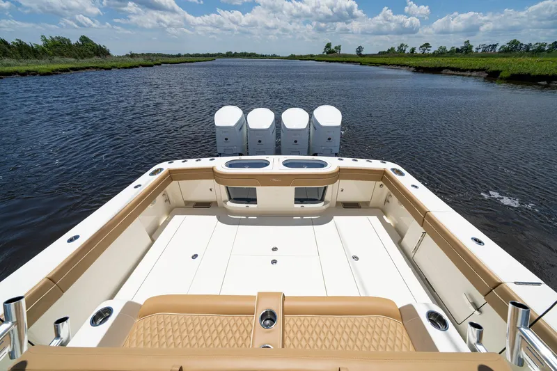 Slide: The Image of 2023 Valhalla Boatworks V-46 luxury deck, scenic water view, sunny day. - 16