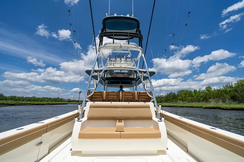 Slide: The Image of 2023 Valhalla Boatworks V-46 on water, featuring luxurious seating and sleek design. - 17