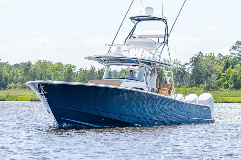 Slide: The Image of 2023 Valhalla Boatworks V-46 in water, featuring sleek design and powerful engines. - 2