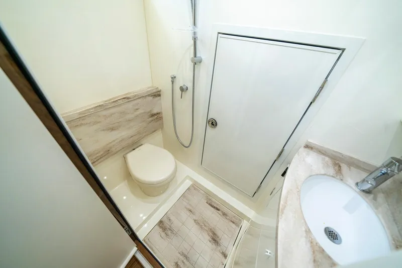 Slide: The Image of Luxurious interior of 2023 Valhalla Boatworks V-46 with wood finishes and modern amenities. - 24