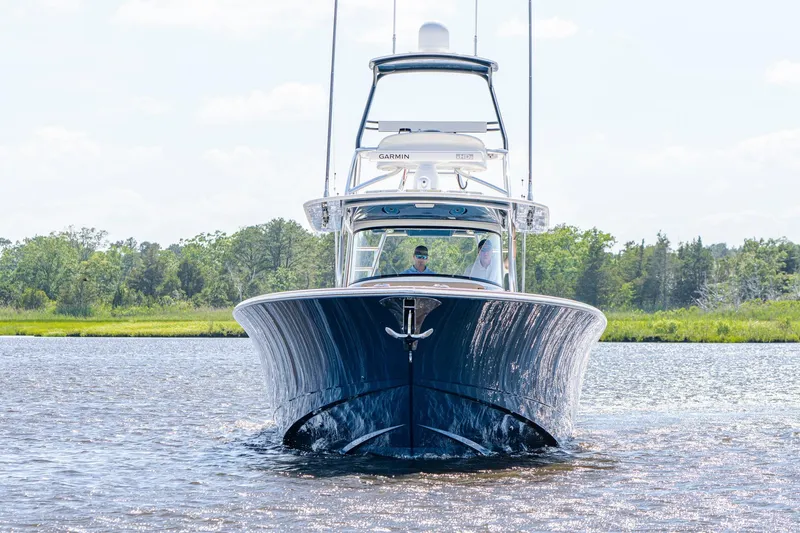 Slide: The Image of 2023 Valhalla Boatworks V-46 with four Mercury outboard engines on water. - 4