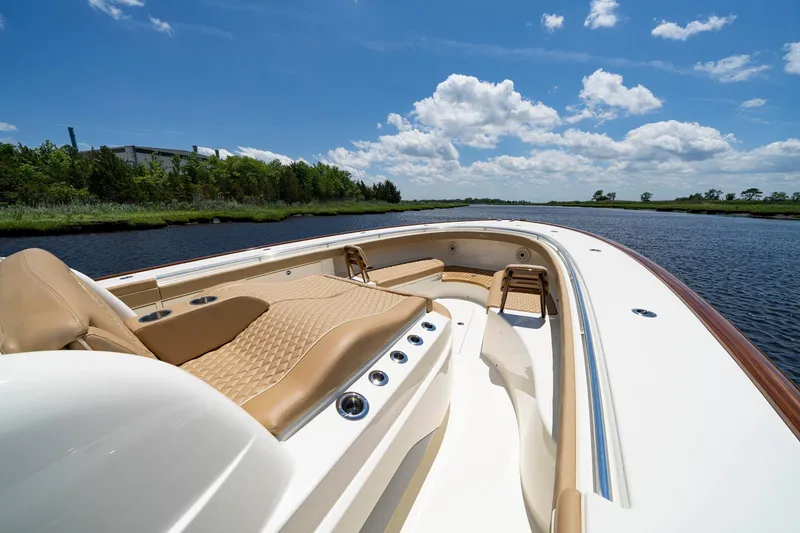 Slide: The Image of 2023 Valhalla Boatworks V-46 on water, featuring spacious deck and powerful engines. - 6