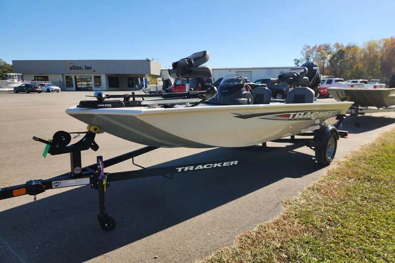 Slide: The Image of 2026 Tracker Pro 170 boat on trailer in parking lot, sunny day. - 6