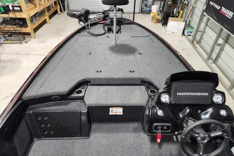 Slide: The Image of 2019 Nitro Z20 Pro boat interior with Humminbird electronics and steering wheel in a garage setting. - 9