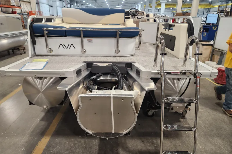 Slide: The Image of 2026 Avalon LSZ 2585 Entertainer Triple toon pontoon boat in a factory setting. - 11
