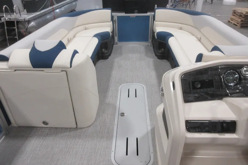 Slide: The Image of 2026 Avalon LSZ 2585 Entertainer Triple toon interior with plush seating and modern dashboard. - 13