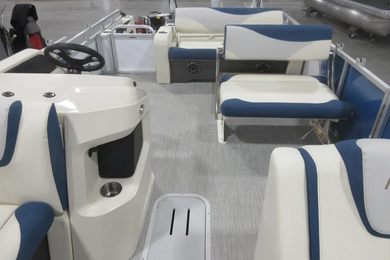 Slide: The Image of 2026 Avalon LSZ 2585 Entertainer Triple toon interior with blue and white seating. - 14