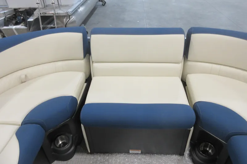 Slide: The Image of Luxurious seating on 2026 Avalon LSZ 2585 Entertainer Triple toon boat, featuring blue and cream upholstery. - 22