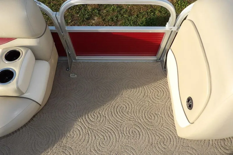 Slide: The Image of Interior of 2012 Sun Tracker Party Barge 22 DLX with beige seating and patterned carpet. - 11
