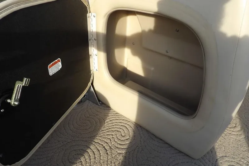 Slide: The Image of Open storage compartment on 2012 Sun Tracker Party Barge 22 DLX boat. - 12
