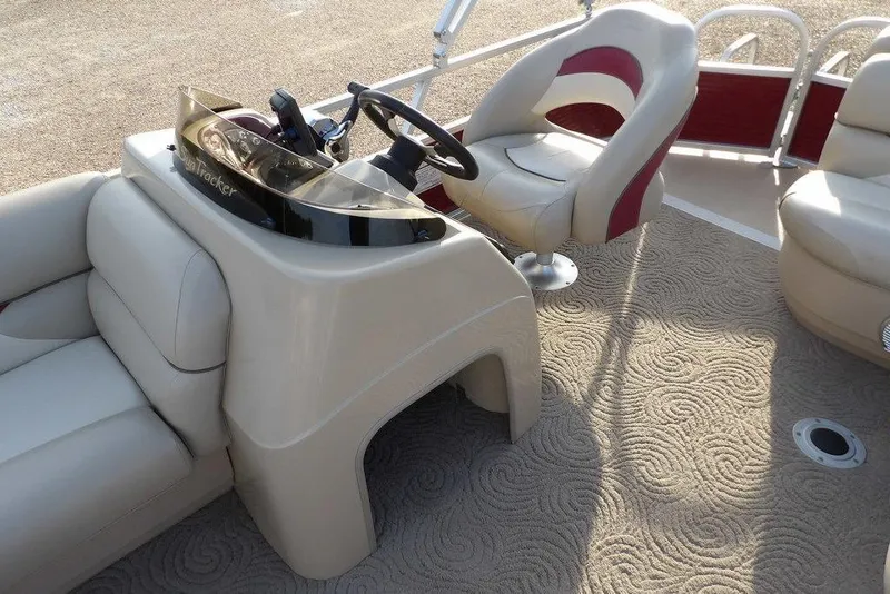 Slide: The Image of 2012 Sun Tracker Party Barge 22 DLX interior with steering console and seating. - 14