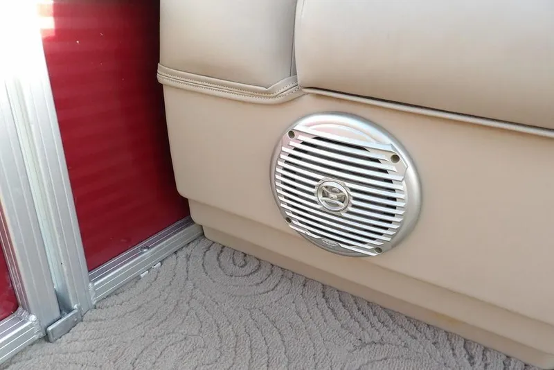 Slide: The Image of Sun Tracker Party Barge 22 DLX 2012 interior speaker and beige upholstery detail. - 15