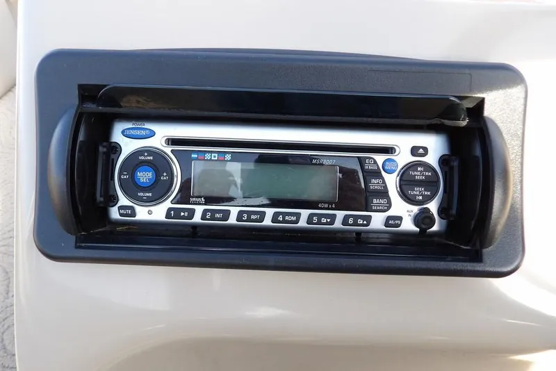 Slide: The Image of Jensen stereo system on 2012 Sun Tracker Party Barge 22 DLX boat dashboard. - 18