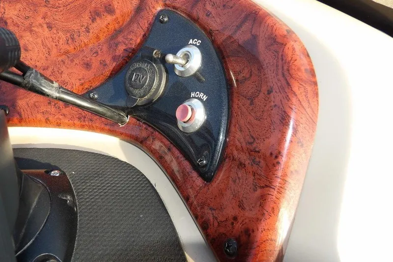 Slide: The Image of Control panel of 2012 Sun Tracker Party Barge 22 DLX with wood finish. - 22