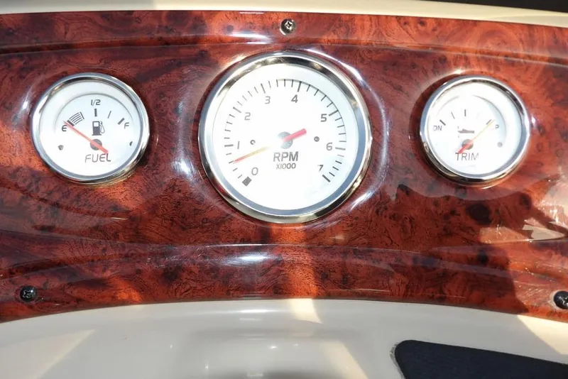 Slide: The Image of Dashboard gauges of 2012 Sun Tracker Party Barge 22 DLX boat. - 23