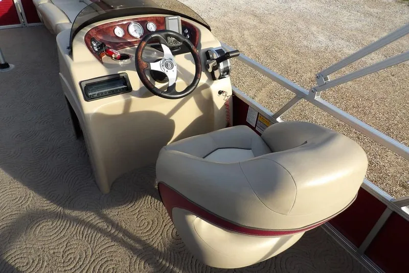 Slide: The Image of 2012 Sun Tracker Party Barge 22 DLX helm with steering wheel and controls. - 24