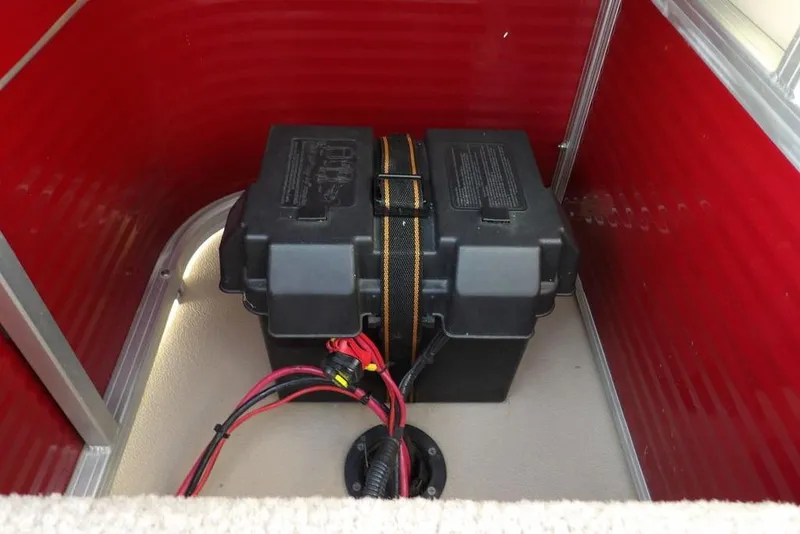 Slide: The Image of Battery compartment of 2012 Sun Tracker Party Barge 22 DLX with red interior. - 27