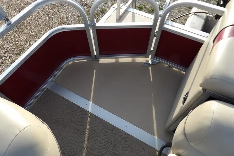 Slide: The Image of Interior of 2012 Sun Tracker Party Barge 22 DLX with beige seating and red paneling. - 33