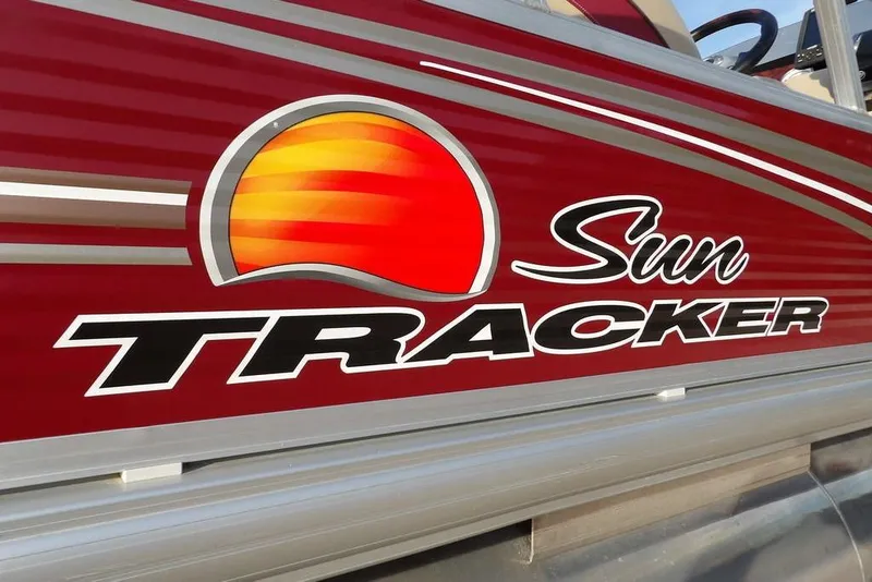 Slide: The Image of Sun Tracker Party Barge 22 DLX 2012 logo on red boat exterior. - 41