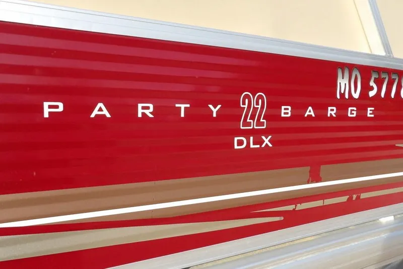 Slide: The Image of Red 2012 Sun Tracker Party Barge 22 DLX boat side view. - 42