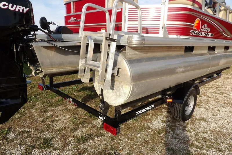 Slide: The Image of 2012 Sun Tracker Party Barge 22 DLX on trailer, featuring Mercury outboard motor. - 44