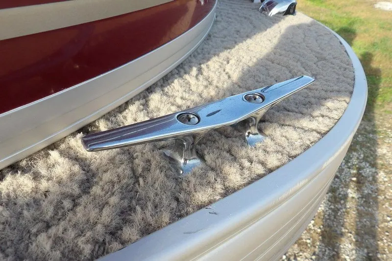 Slide: The Image of Close-up of a 2012 Sun Tracker Party Barge 22 DLX boat cleat on carpeted deck. - 45