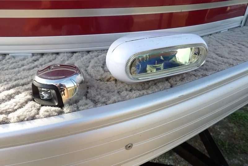 Slide: The Image of 2012 Sun Tracker Party Barge 22 DLX boat lights on carpeted deck. - 47