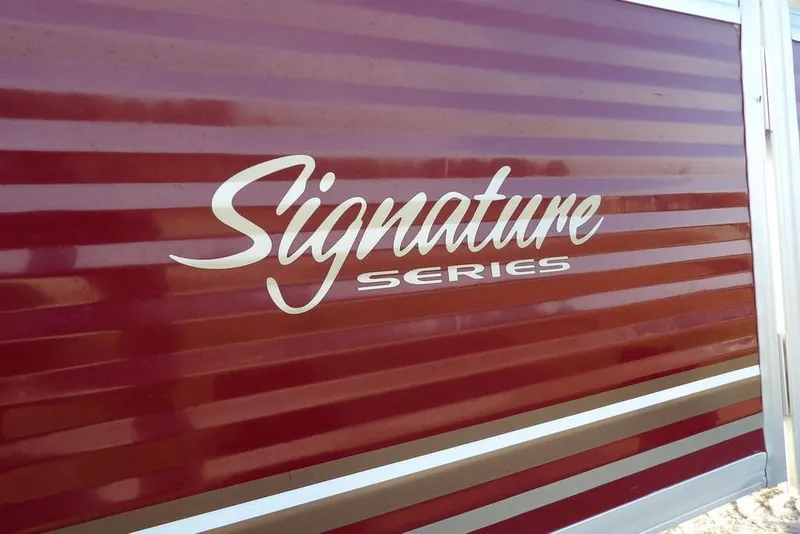 Slide: The Image of 2012 Sun Tracker Party Barge 22 DLX, Signature Series logo on red panel. - 50