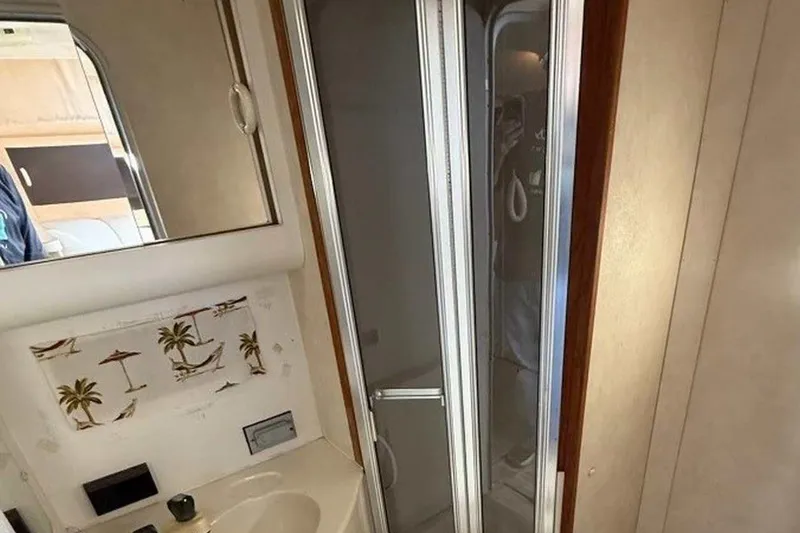 Slide: The Image of Bathroom interior of 1990 Silverton 34 Convertible yacht with shower and sink. - 12