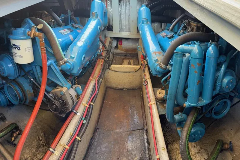 Slide: The Image of Engine room of a 1990 Silverton 34 Convertible boat with blue machinery. - 17