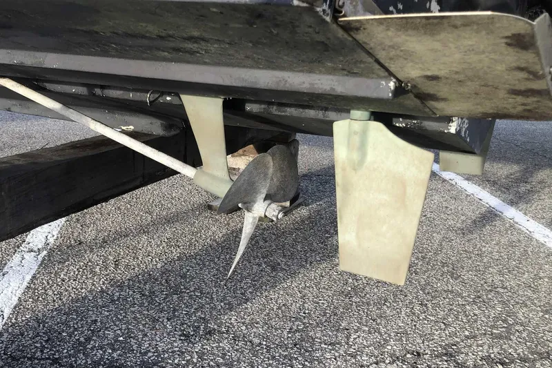 Slide: The Image of Propeller and rudder of a 1990 Silverton 34 Convertible boat on a trailer. - 31