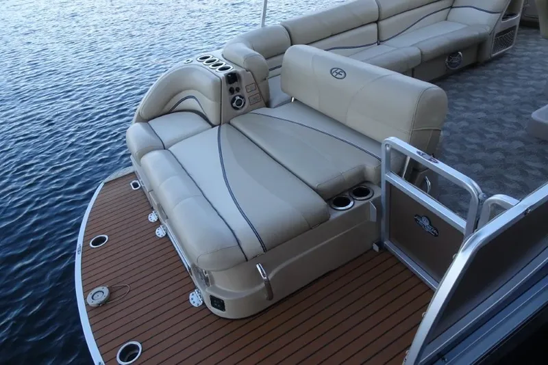 Slide: The Image of 2010 Harris Grand Mariner 230 pontoon boat with beige seating and wooden deck. - 11