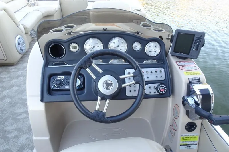 Slide: The Image of Steering console of 2010 Harris Grand Mariner 230 pontoon boat with gauges and controls. - 15