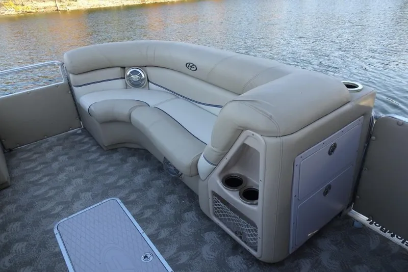 Slide: The Image of Luxurious seating on 2010 Harris Grand Mariner 230 pontoon boat by the water. - 19
