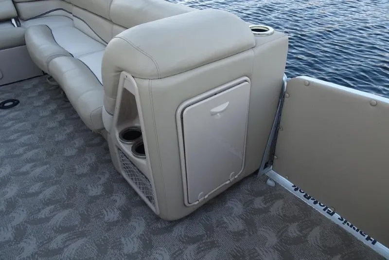 Slide: The Image of Luxurious seating on 2010 Harris Grand Mariner 230 pontoon boat with cup holders and storage. - 26