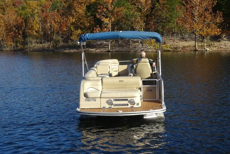 Slide: The Image of 2010 Harris Grand Mariner 230 pontoon boat on a serene lake with autumn trees. - 3