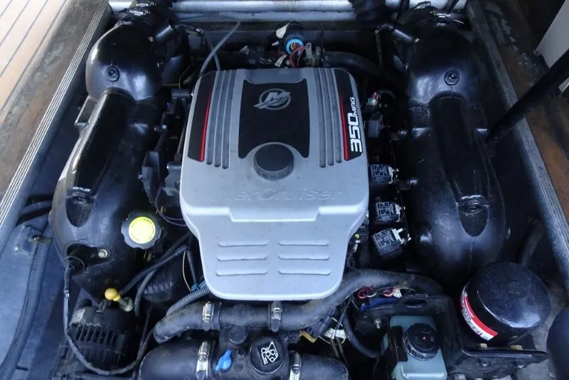 Slide: The Image of Engine of a 2010 Harris Grand Mariner 230 boat, showcasing its components. - 30