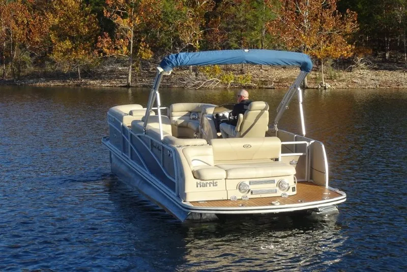 Slide: The Image of 2010 Harris Grand Mariner 230 pontoon boat on a serene lake with autumn trees. - 4