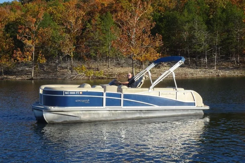 Slide: The Image of 2010 Harris Grand Mariner 230 pontoon boat on a lake with autumn trees in the background. - 6