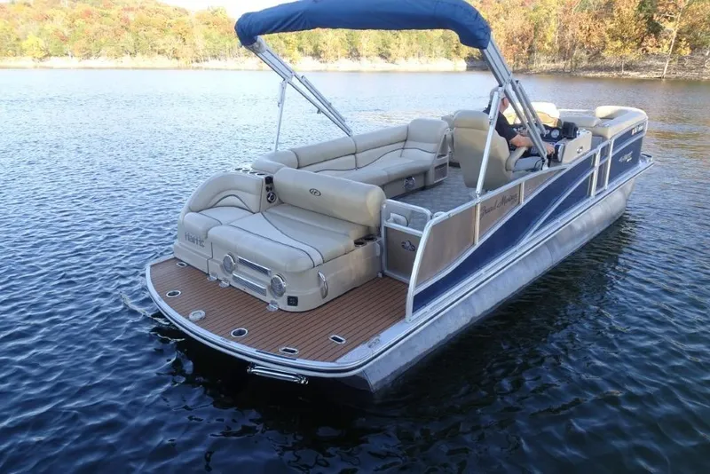 Slide: The Image of 2010 Harris Grand Mariner 230 pontoon boat on a serene lake with autumn foliage. - 8