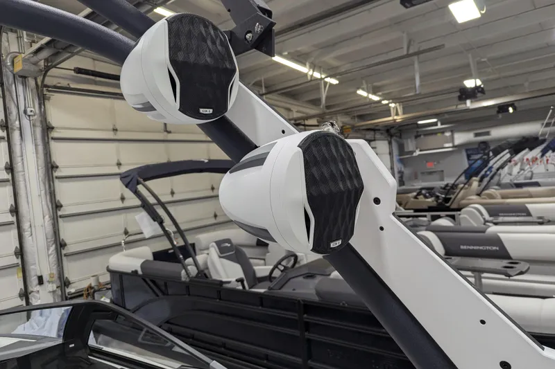 Slide: The Image of 2026 Malibu Wakesetter 22 MXZ boat speakers in a showroom setting. - 14