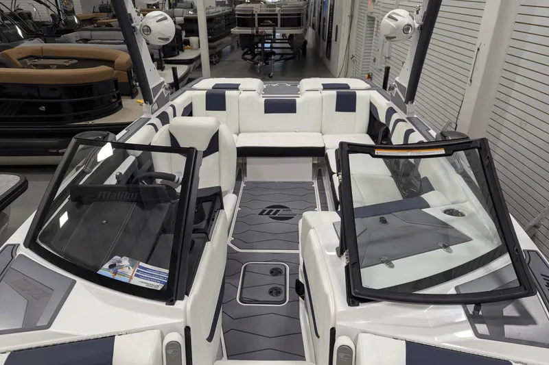 Slide: The Image of 2026 Malibu Wakesetter 22 MXZ boat interior with sleek seating and modern design. - 16