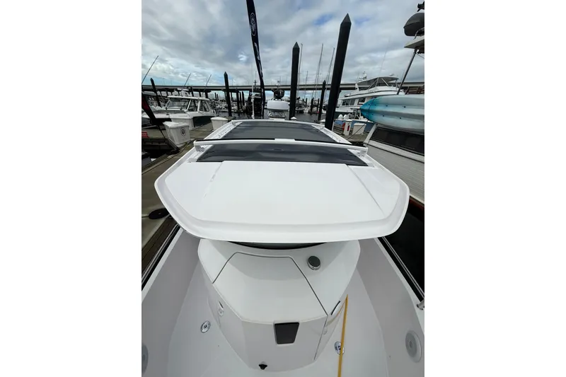 Slide: The Image of 2023 Axopar 28 Cabin Wet Bar with sink and safety instructions. - 11