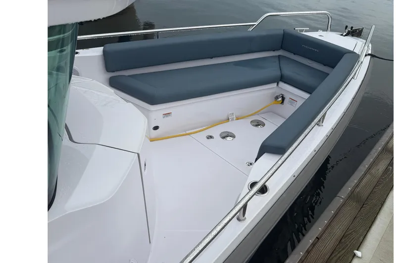 Slide: The Image of 2023 Axopar 28 Cabin Wet Bar with dual Mercury engines at dock. - 6