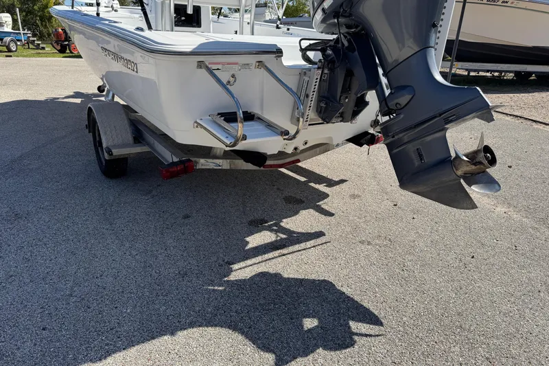 Slide: The Image of 2016 Sportsman Island Bay 20 boat on trailer, rear view with outboard motor. - 10