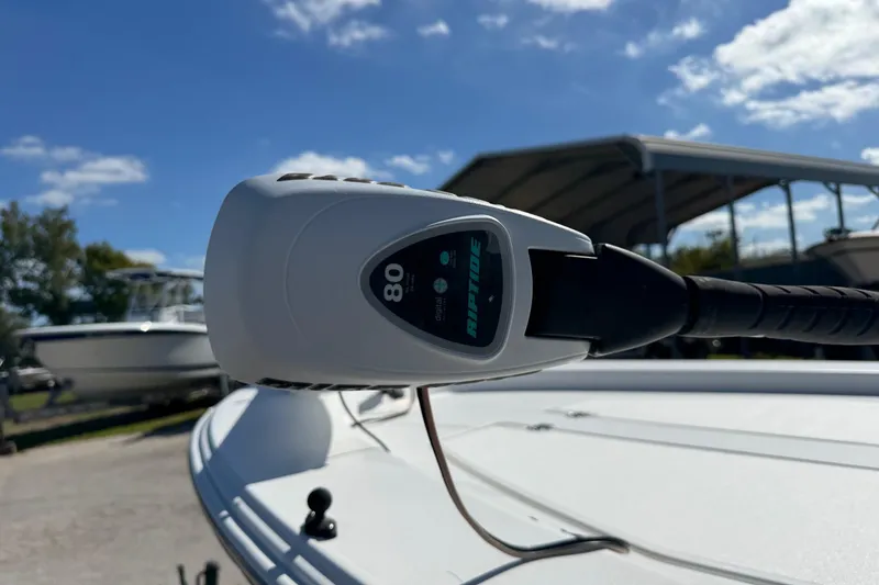 Slide: The Image of Trolling motor on 2016 Sportsman Island Bay 20 boat under clear blue sky. - 12