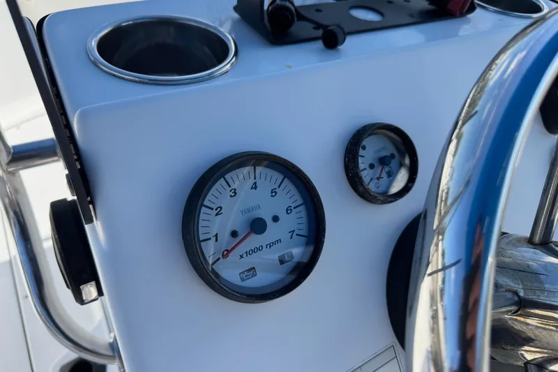 Slide: The Image of 2016 Sportsman Island Bay 20 boat dashboard with Yamaha RPM gauge. - 20