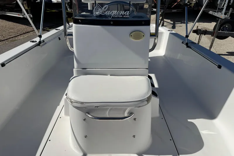 Slide: The Image of 2016 Sportsman Island Bay 20 boat interior with seating and steering console. - 22